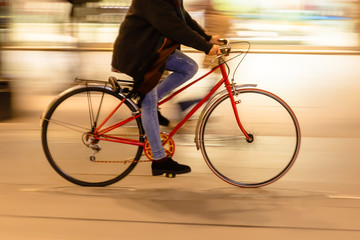 bicycle rider in the city at night