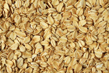 Food background - oat-flakes situated arbitrarily