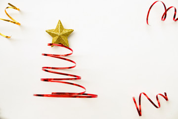 Merry Chistmas tree made from red ribbon and gold star on white background. Merry chirstmas and happy new year concept.