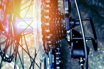 bicycle wheel hub details close up rear mountain bike back wheel red with chain bike gearshift mechanism