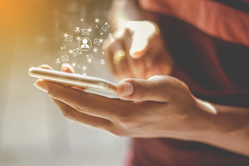 Communication technology, Female businessmen are using smartphones with email icons, email ideas.