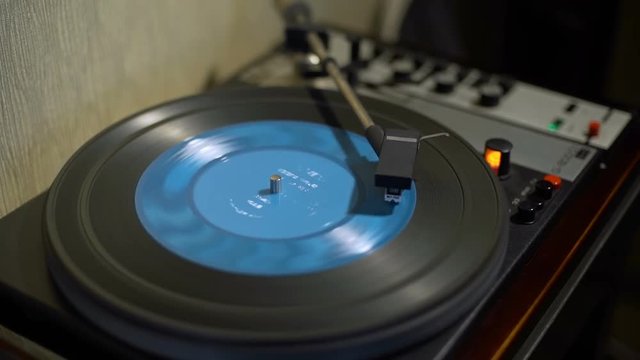 Vintage Turntable and Blue Vinyl Record