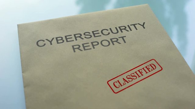 Cybersecurity report classified, stamping seal on folder with important document
