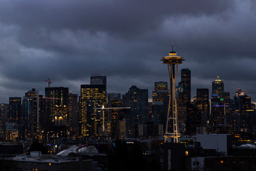 Night view of Downtown Seattle with iconic architect and dark clouds