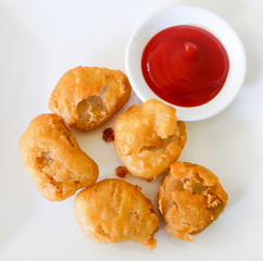 nuggets chicken and tomato sauce / chicken nuggets crispy fried ketchup sauce on white plate top view