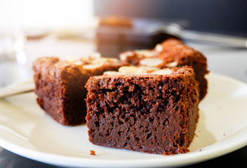 brownies cake on the table / piece of chocolate cake cocoa with nut on top view brownies slice