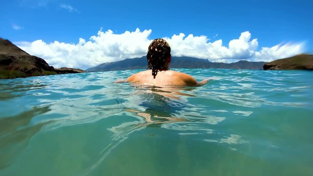 Tahuata Marquesas young female on deserted ocean beach