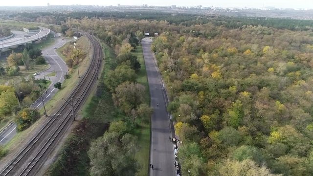 Filming of running athletes along the road next to the rails from the top on the half marathon in Zaporizhia 6