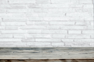 blank wood table with white brick wall background