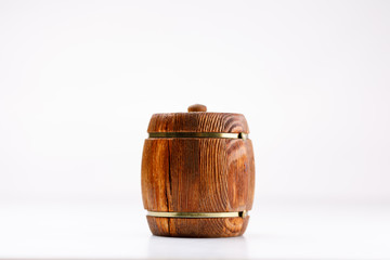 An isolated barrel on a white background. Wooden container for honey.