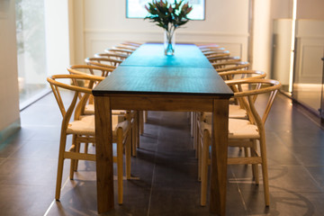 empty cafe restaurant large wooden tables and chairs