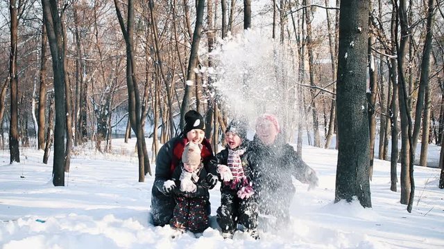 Happy family in winter park. Joy and festive christmas mood.