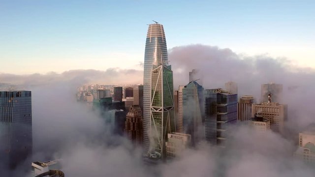 Downtown San Francisco Skyline Covered in Thick Low Fog on Blue Sky Day