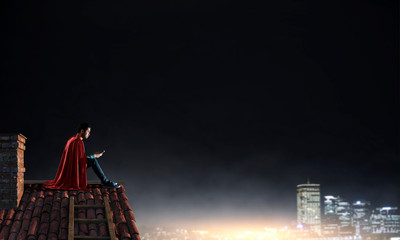 Super hero on roof. Mixed media