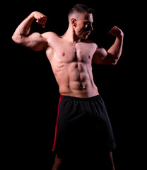 Fototapeta na wymiar Sporty muscular man isolated
