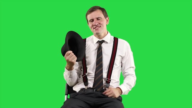 Satisfied businessman in white shirt on green background. Portrait of modern young businessman.