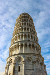 Fototapeta na wymiar Leaning tower of pisa closeup view with a sky and clouds, Tuscany, Italy