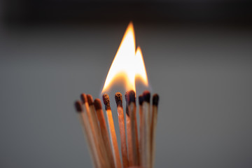 burning match on black background