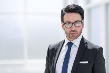 Naklejka premium beautiful businessman in the office background