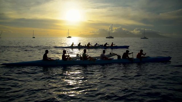 Outrigger canoe Moorea Island from Tahiti at sunset