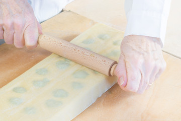 Italian pasta. Preparation of tortelli with spinach and ricotta 