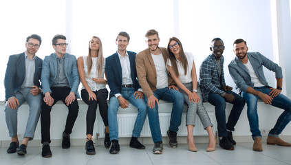 Obraz premium young people are waiting for an interview, sitting in the office lobby