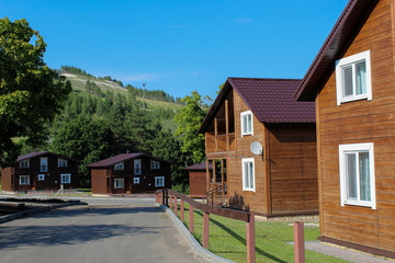 A country road passes farmhouses on a bright Sunny day © Yulia