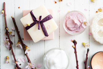 Beauty products and peach flowers
