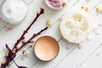Beauty products and peach flowers