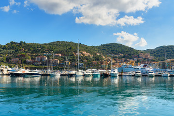 Fototapeta na wymiar View of harbor seafront in seaport town Porto Santo Stefano in Monte Argentario. Italy