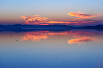 View of sunrise in lagoon Orbetello on peninsula Argentario. Italy