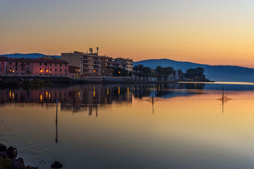 View of Orbetello in lagoon on peninsula Argentario at sunrise. Italy