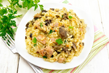 Risotto with mushrooms and chicken on board