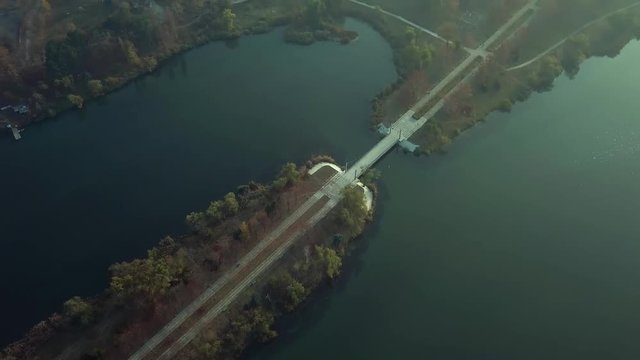 Aerial footage over Echo Park Lake, Kishinev, Moldova republic of. View of lake and smille bridge.