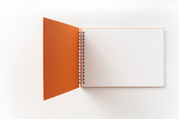 spiral orange notebook with open cover