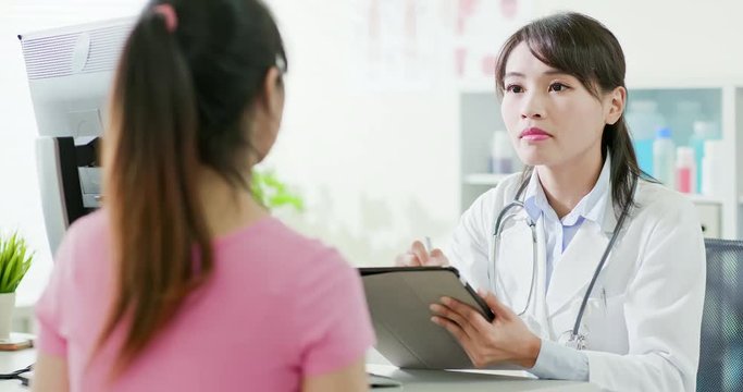 female doctor consulting patient