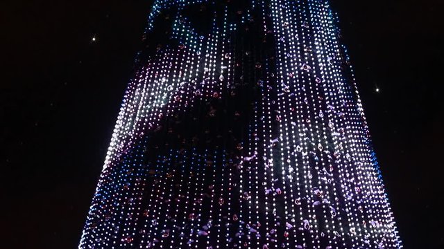 Christmas tree. located on the street. shallow depth of field. The shooting took place late in the evening.
