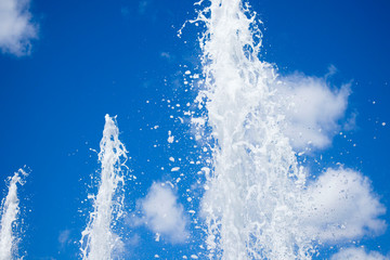 Obraz na płótnie Canvas beautiful fountains against the blue summer sky
