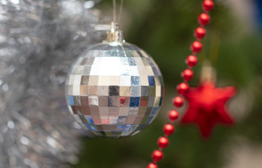Toy hanging on a Christmas tree in Christmas