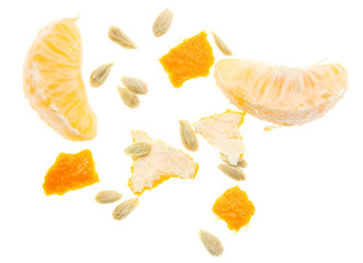 Naklejka na ściany i meble Seeds and peel in tangerines on a white background
