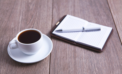 Obraz na płótnie Canvas coffee and notebook