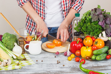 Woman cooks at the kitchen, body part, blurred background