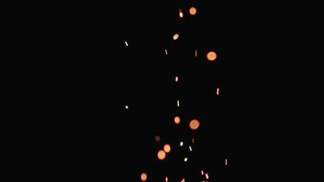 Slow motion of hot sparks from charcoal moving up on black background, 180fps