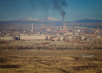 View of the city of Ust-Kamenogorsk (kazakhstan). Autumn steppe. Factories chimneys. Cityscape