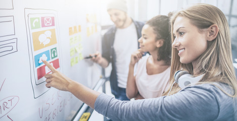 Designers drawing website ux app development.