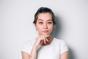 Portrait of beautiful blue eyed girl on a white background