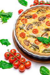 Baked homemade quiche pie in ceramic baking form