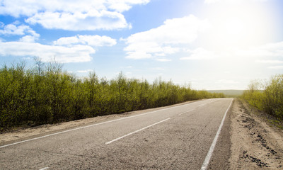 Summer road with the sun shining