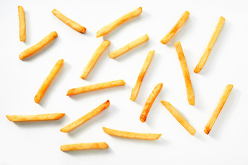 Scattered thin straight fried potato chips