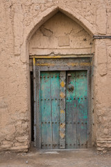 Fototapeta na wymiar Door of a mud house of Birkat Al Mouz